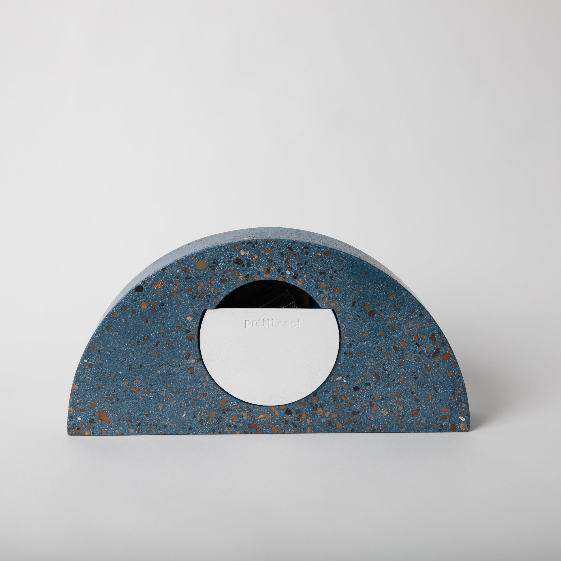 Terrazzo concrete clock in half moon shape in cobalt.