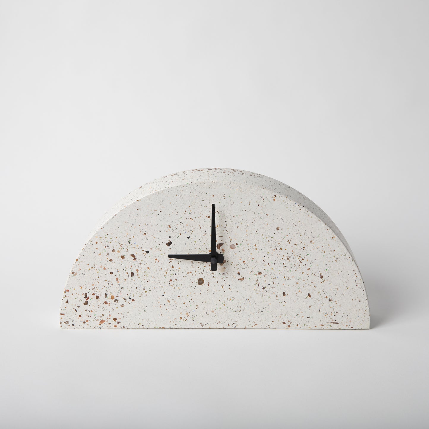 Terrazzo concrete clock in half moon shape in white.