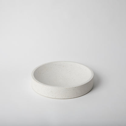 Large concrete centerpiece bowl in white terrazzo with cork base.