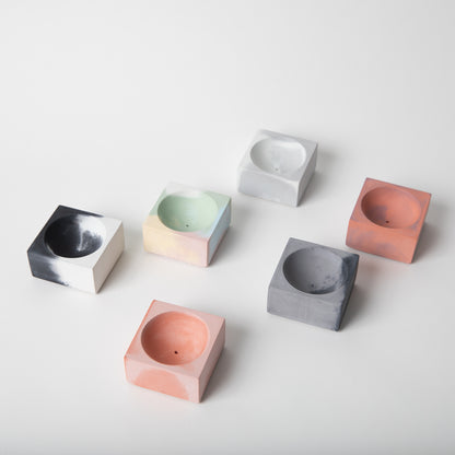 Square concrete incense holder in various colors.