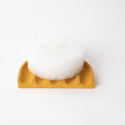 Concrete terrazzo sponge rest in marigold with sponge.